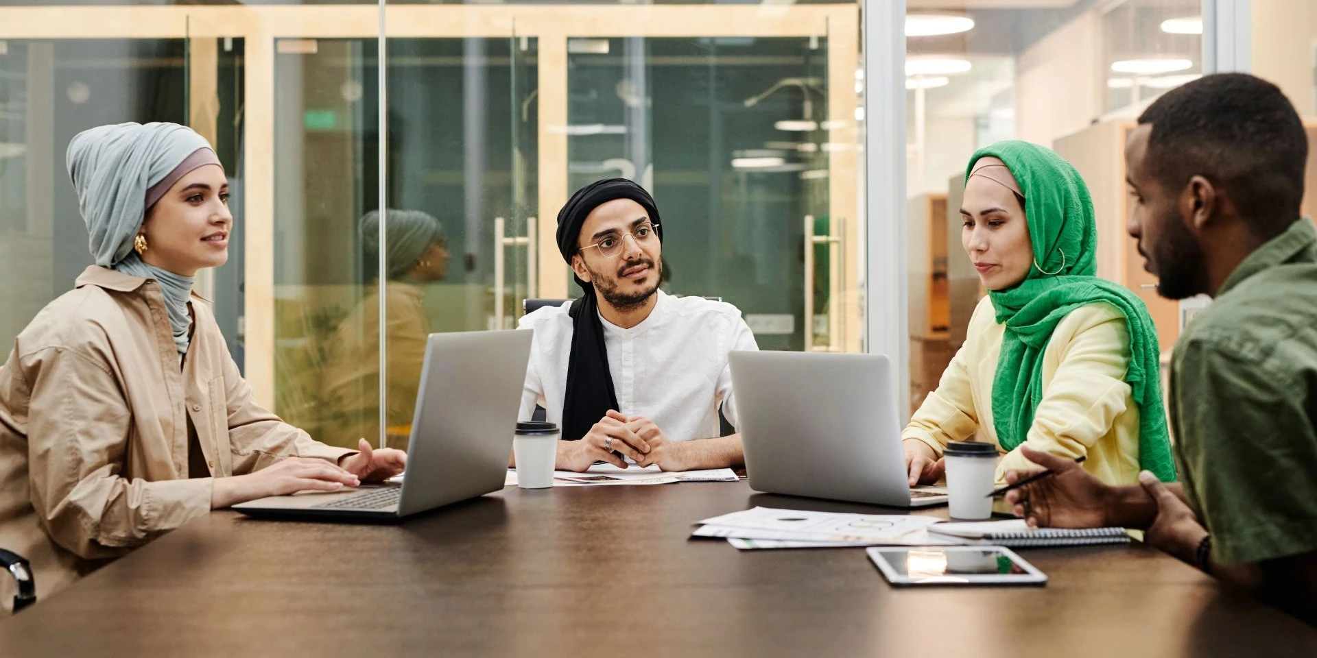 A business meeting with people discussing corporate changes